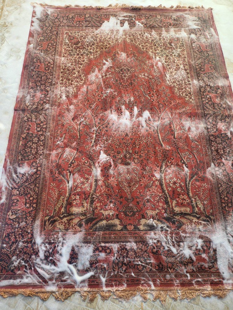 Lavado manual de alfombra oriental en taller
